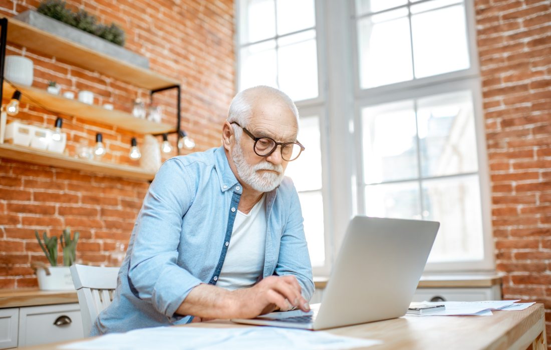 senior-man-with-laptop-at-home-1.jpg